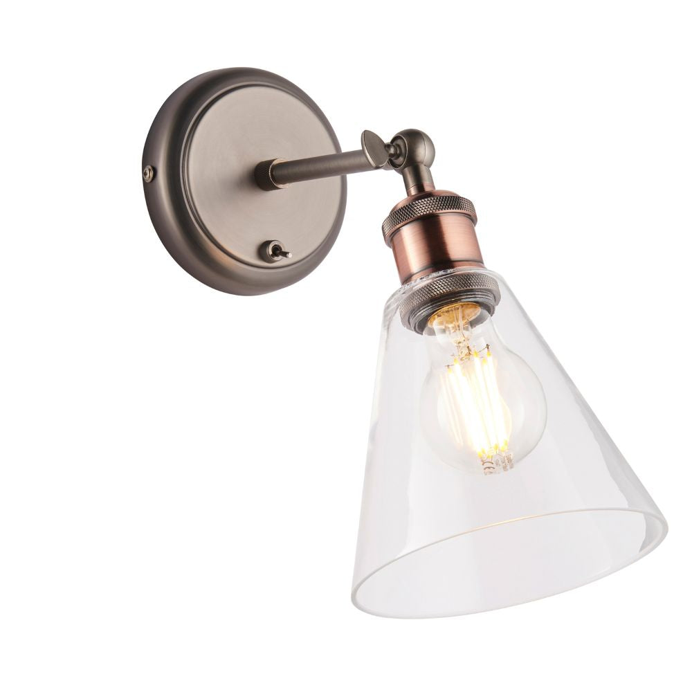 Adjustable industrial wall sconce with a clear glass shade, exposed bulb and metal wall mount.