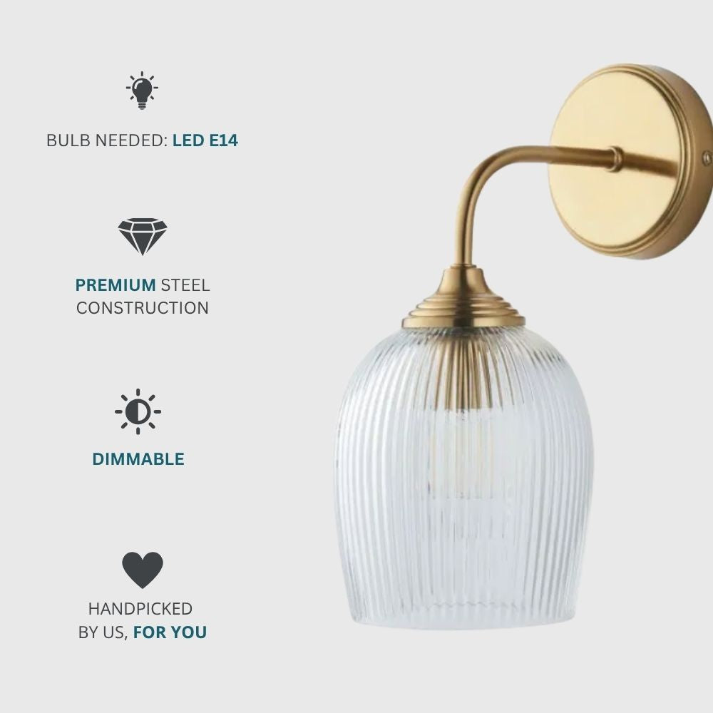 Aged brass wall light requiring E14 LED bulb, with premium steel construction and dimmable functionality.