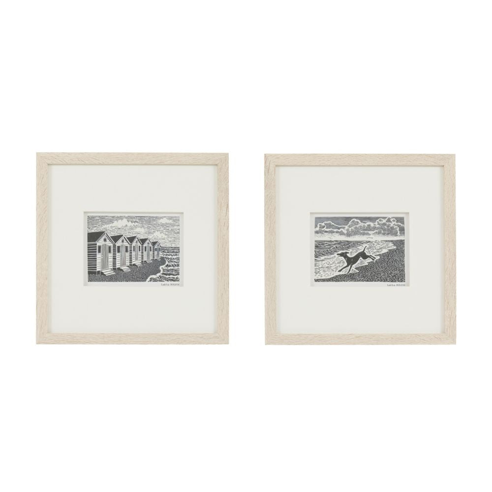 Pair of black and white seaside linocut art prints with natural wood-effect frames and minimalist coastal design.