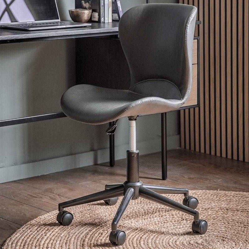 Sleek black faux leather swivel office chair, offering a stylish and comfortable seating solution for any workspace.


