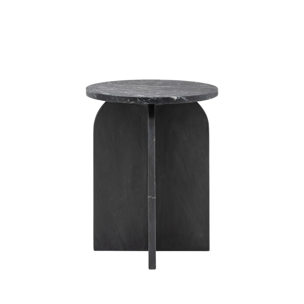 Black marble side table with round top and curved sculptural base featuring natural veining on a white background.