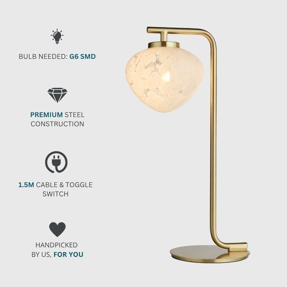 Brass and glass table lamp with textured shade shown alongside feature icons highlighting G9 SMD bulb requirement, premium steel construction, and cable with toggle switch.