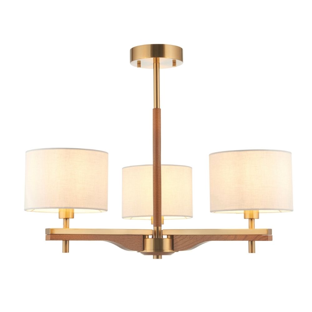 Front view of brass and ash wood three light semi flush ceiling fixture with neutral linen drum shades.