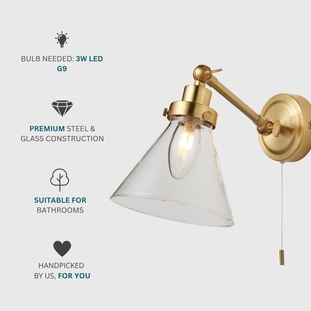 Bathroom wall light in brass with clear glass shade requiring G9 LED bulb, made from premium steel and glass and suitable for bathrooms.