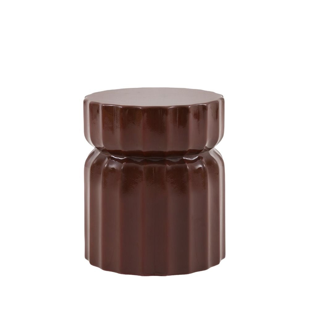 Brown glass fibre reinforced concrete side table with fluted ridged design and rounded silhouette on white background.