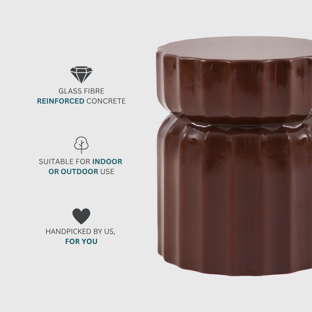 Modern brown ridged concrete side table highlighting durable glass fibre reinforced construction and sculptural form.