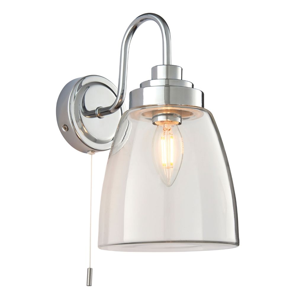 Modern chrome wall light with a clear glass shade and pull cord switch displayed on a plain background.