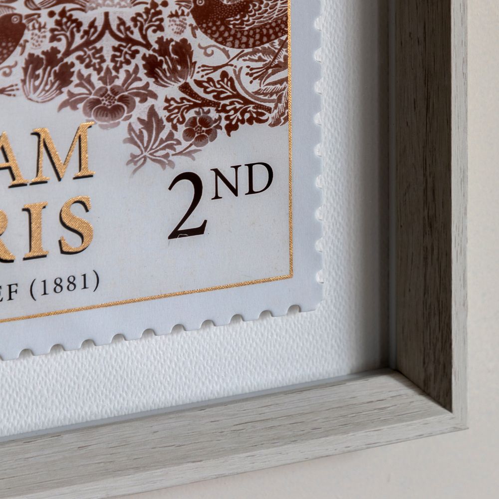 Detailed close-up of William Morris Strawberry Thief framed print featuring intricate bird and floral motifs with gold foil accents.