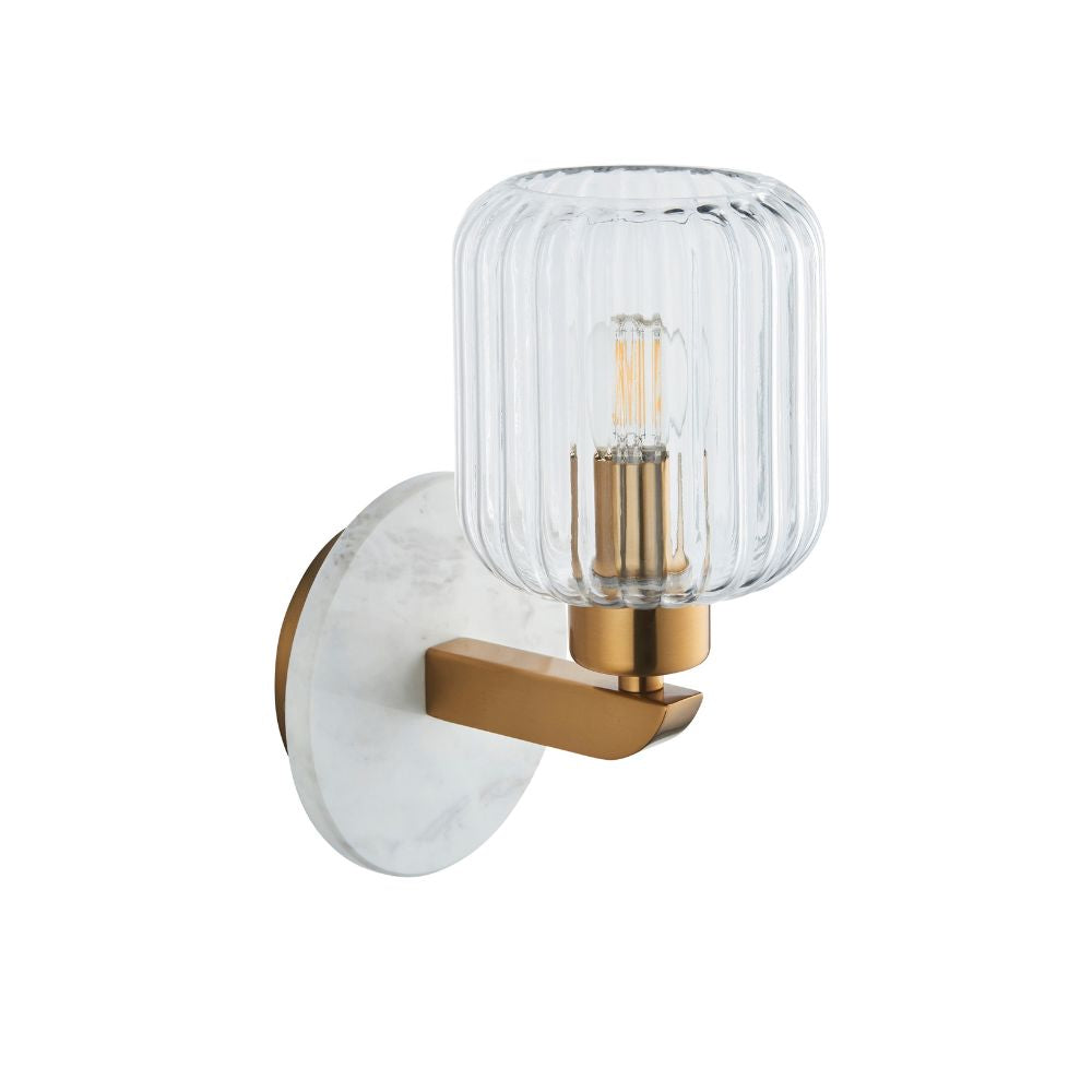 Contemporary brass wall sconce featuring a ribbed clear glass shade and elegant white marble-effect circular backplate.