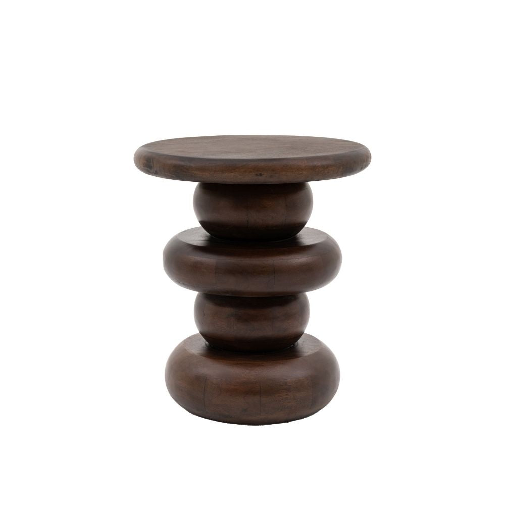 Dark mango wood round sculptural side table with bold stacked silhouette isolated on white background.