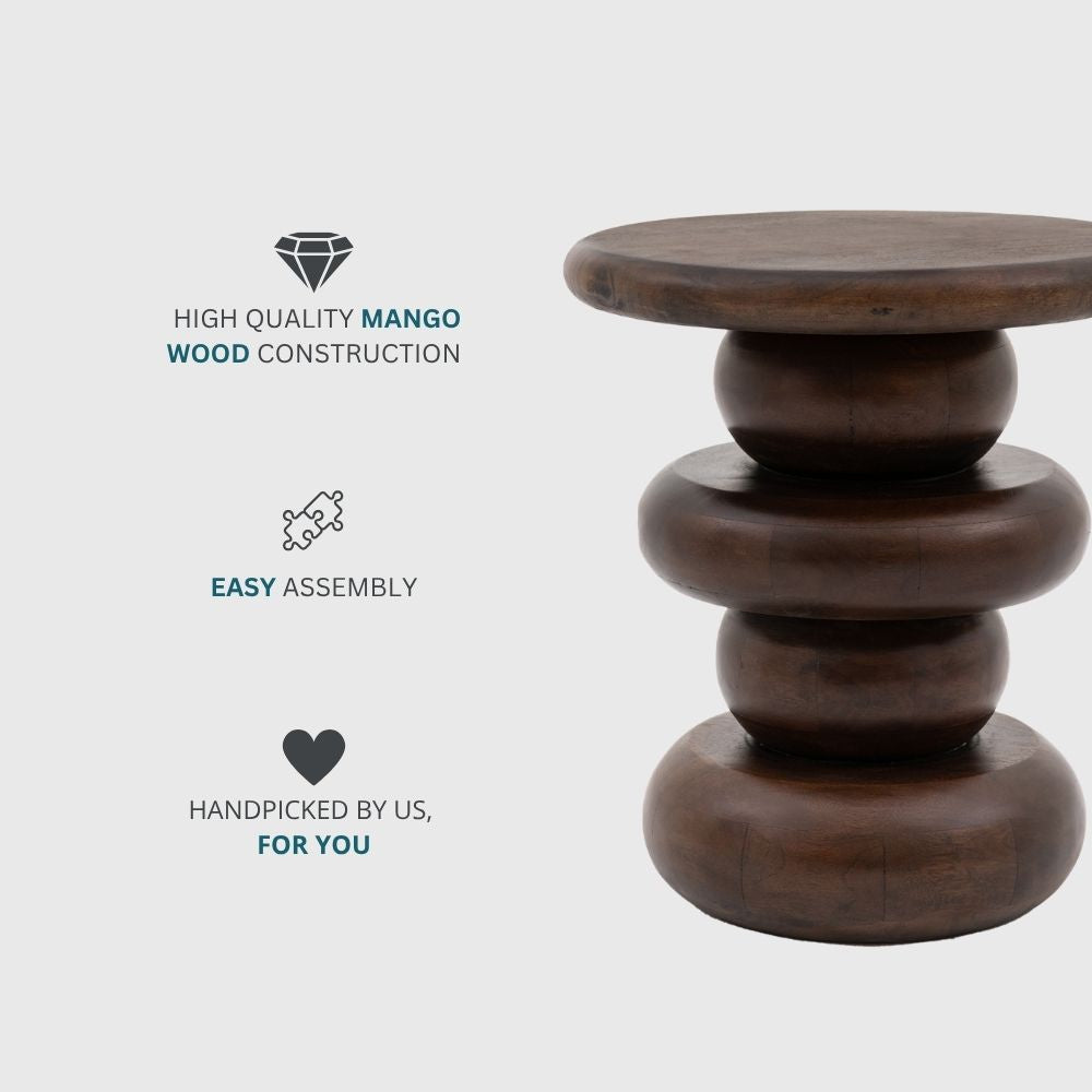 Dark mango wood sculptural retro side table with stacked rounded base and smooth circular top.