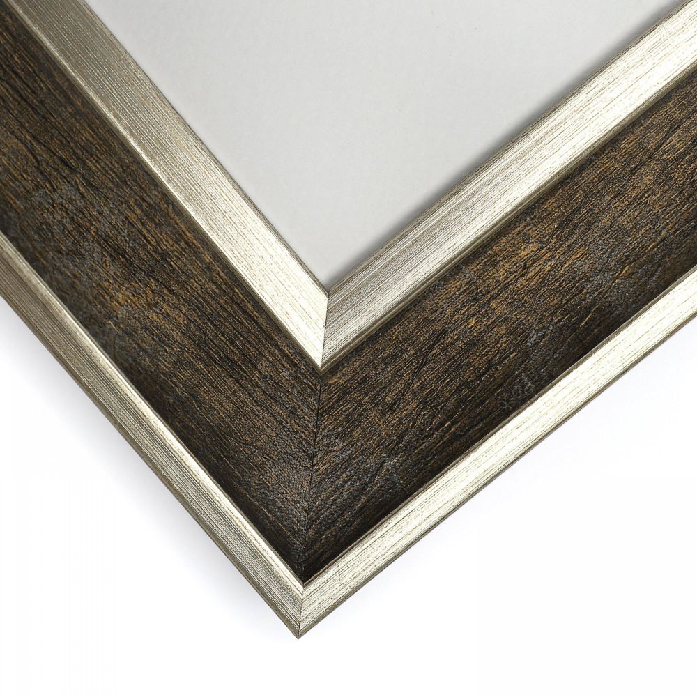 Close-up of a dark wood and silver picture frame corner with brushed metallic detailing and textured finish.