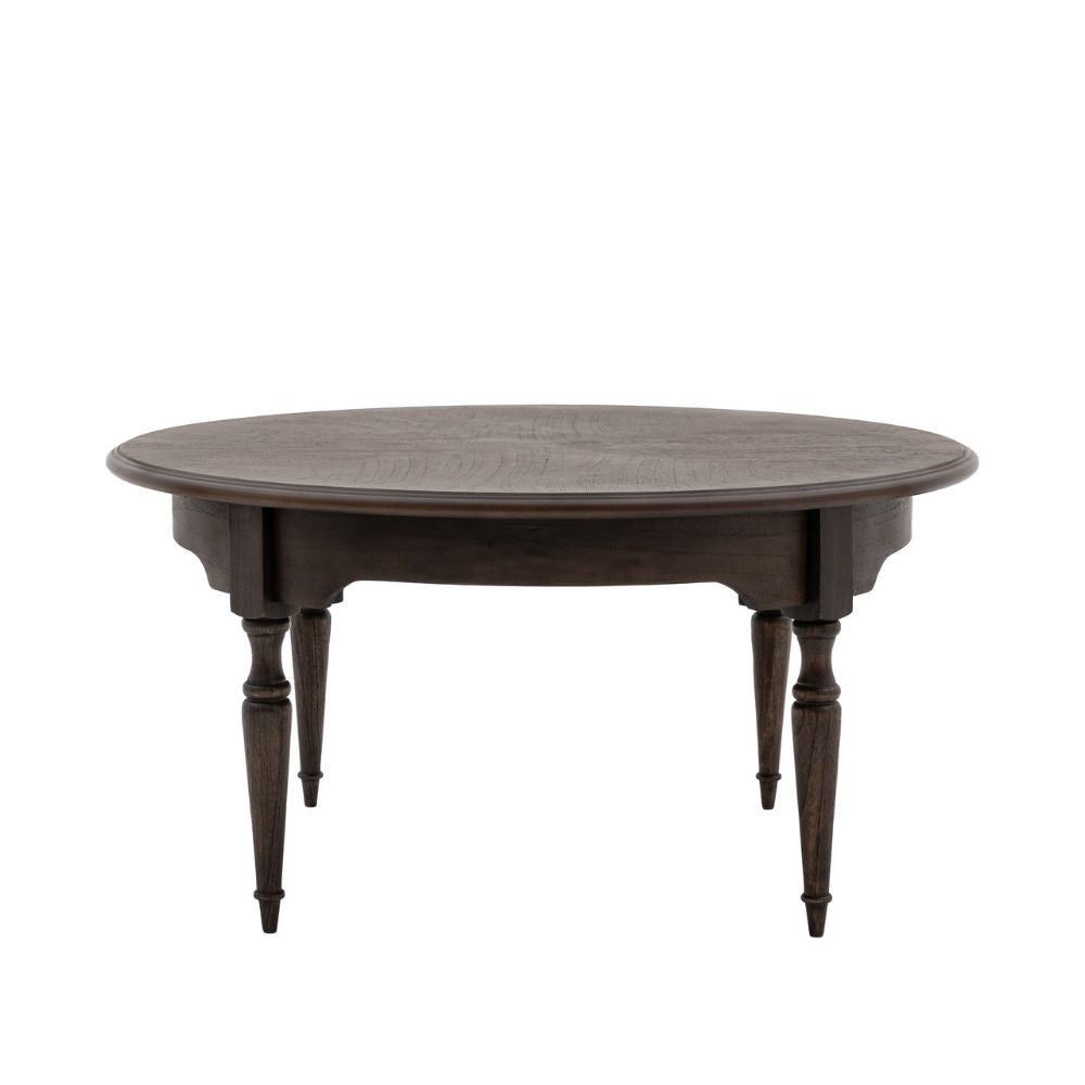 Round coffee table in dark stained wood featuring traditional turned legs and detailed apron design on a plain background.