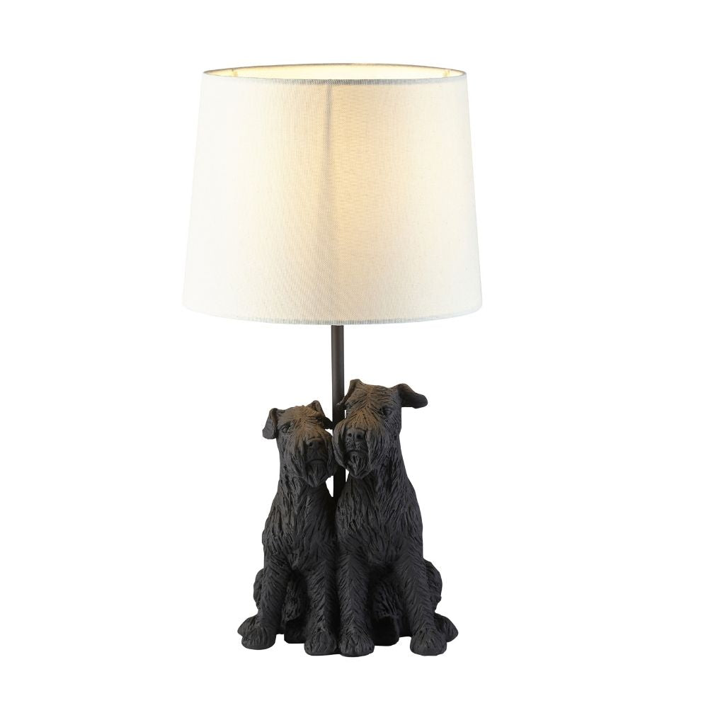 Modern table lamp with double dog resin base and soft fabric shade, isolated on white background showcasing contemporary home décor lighting.