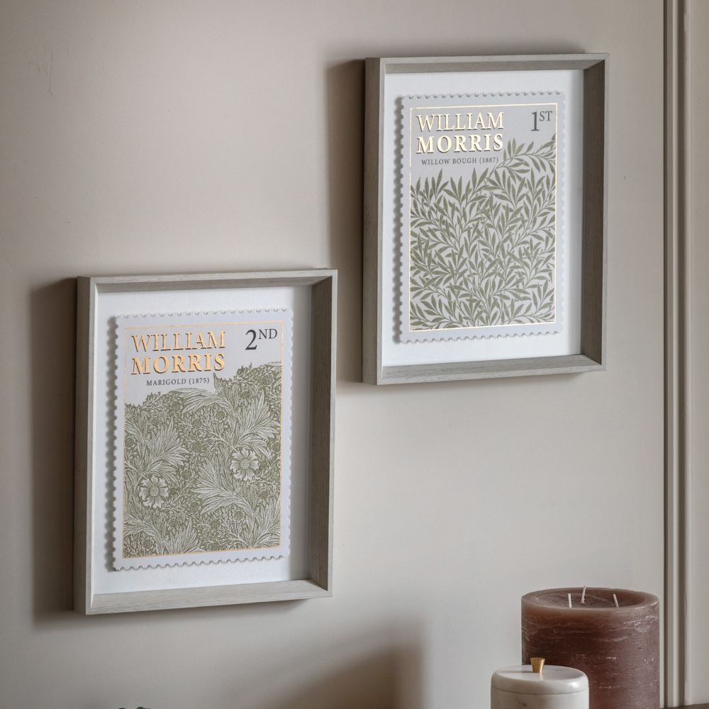 Framed William Morris botanical artwork with stamp-style edging and decorative floral patterns in soft green and gold tones.