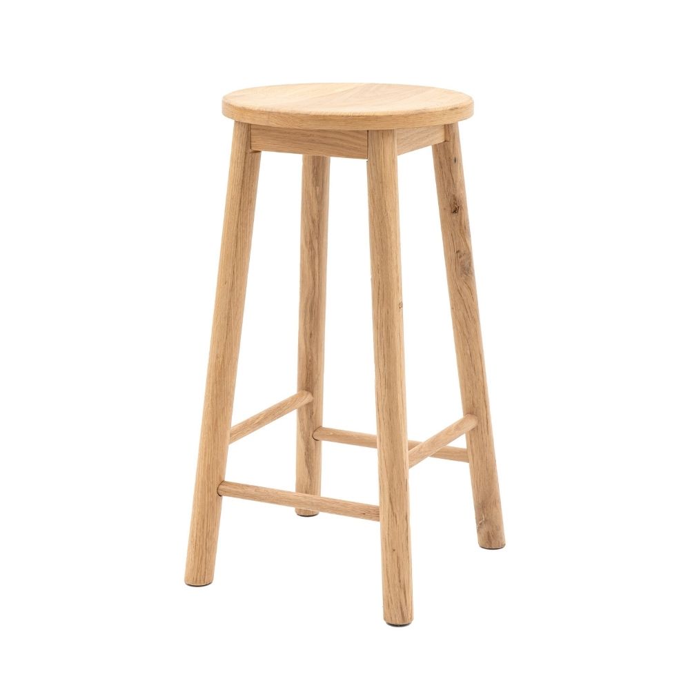 Light oak wooden bar stool with round seat and four legs shown against a plain light background.