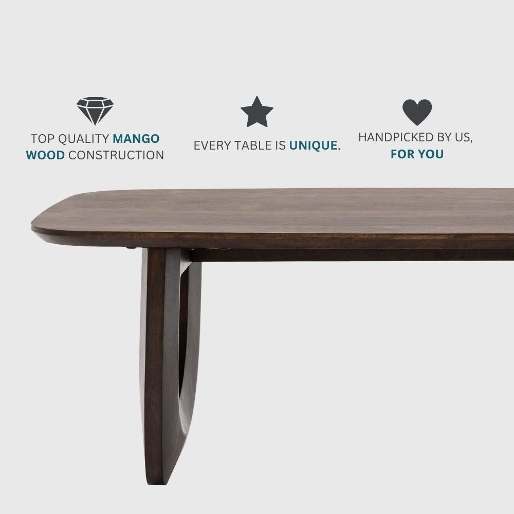 Dark wooden coffee table with icons highlighting top quality mango wood construction, unique handcrafted design and curated styling.