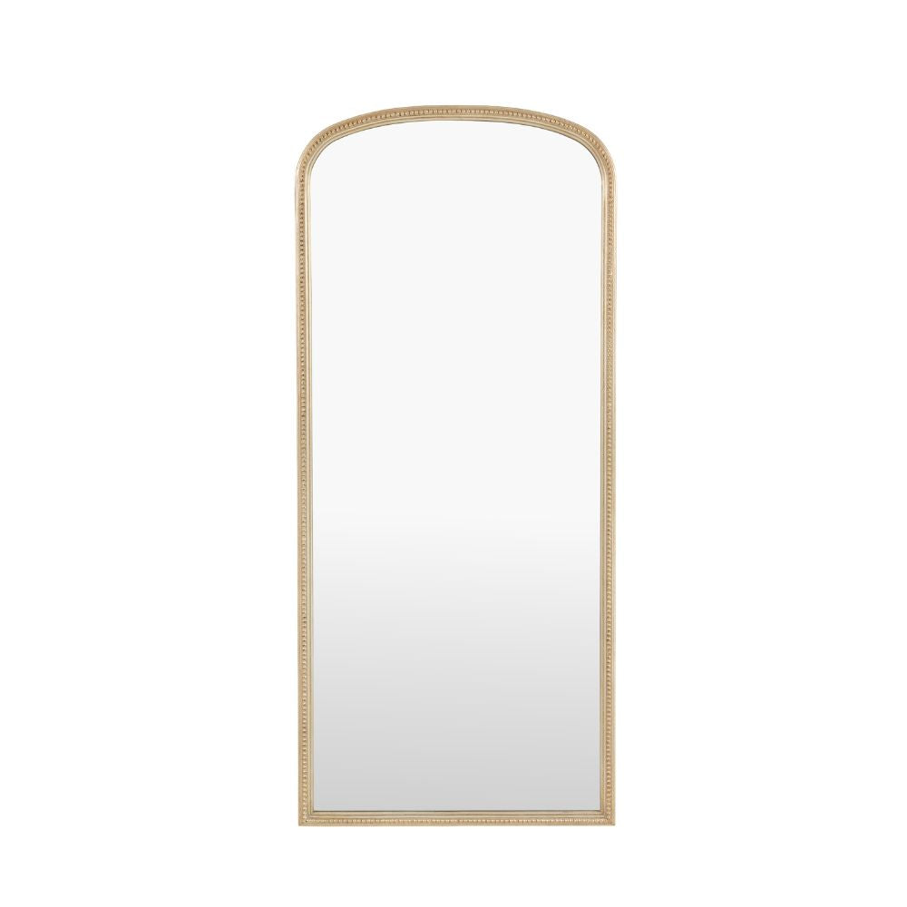 Minimalist arched full length mirror with a slim antique gold frame isolated on a light grey background.