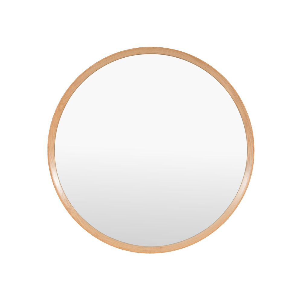 Minimalist round wall mirror with a slim natural oak frame isolated on a light grey background.