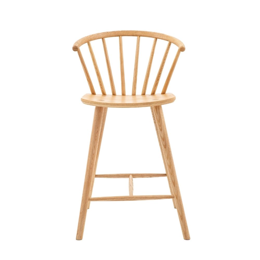 Natural oak wooden bar stool with spindle backrest, curved seat and angled legs shown against a plain light background.