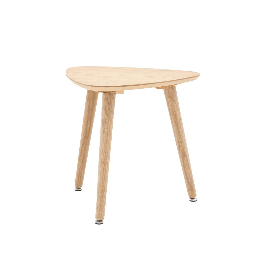 Natural oak side table with triangular top and three tapered legs showcasing minimalist Scandinavian inspired design on a neutral background.