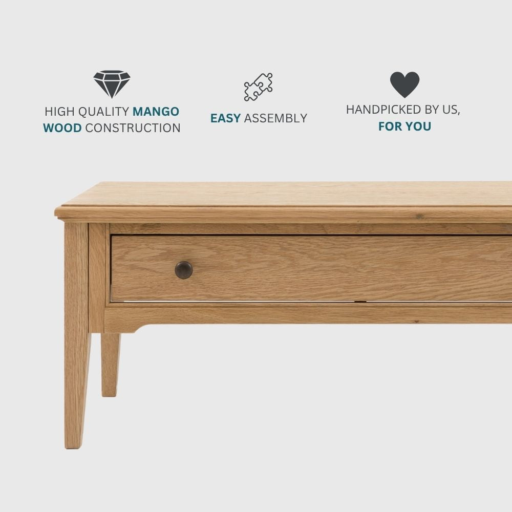 Oak coffee table with drawer shown with icons highlighting high quality wood construction, easy assembly and carefully selected design.