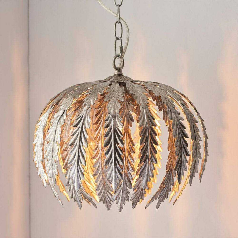 Elegant ornate silver leaf pendant light, perfect for adding a touch of sophistication and luxury to any space.
