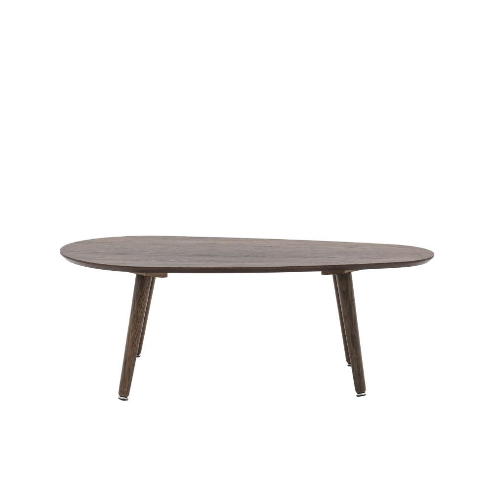 Minimalist oval coffee table in smoked oak finish with tapered Scandinavian legs on a clean neutral background.
