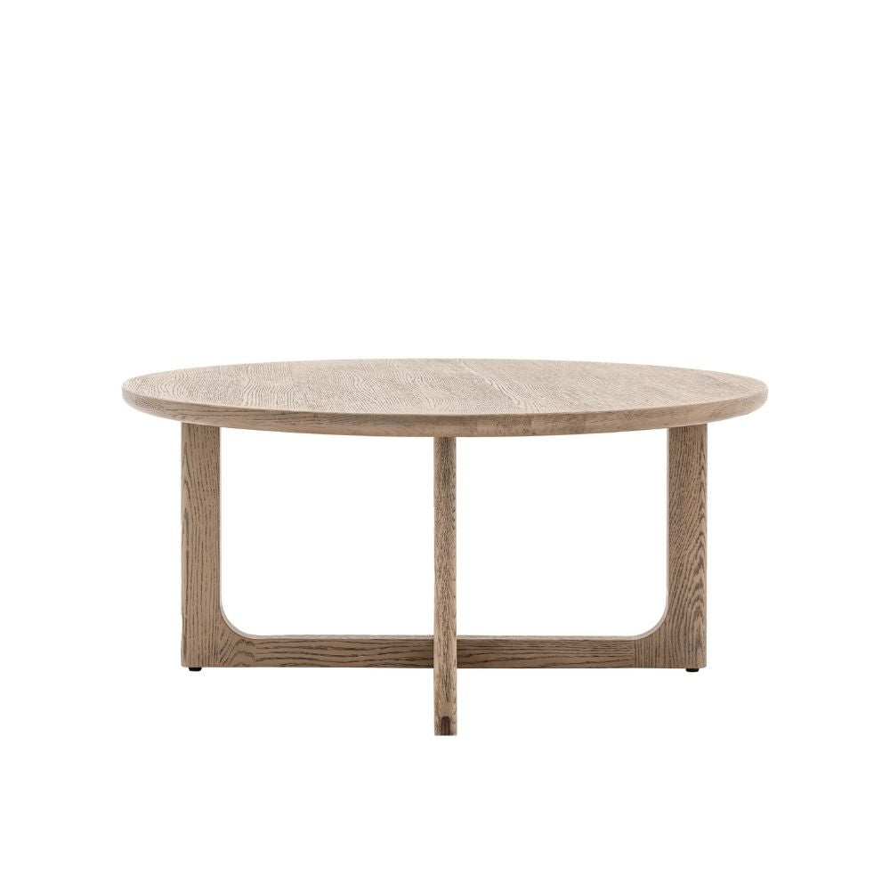 Round smoked oak coffee table with curved frame and minimalist design isolated on a neutral background.