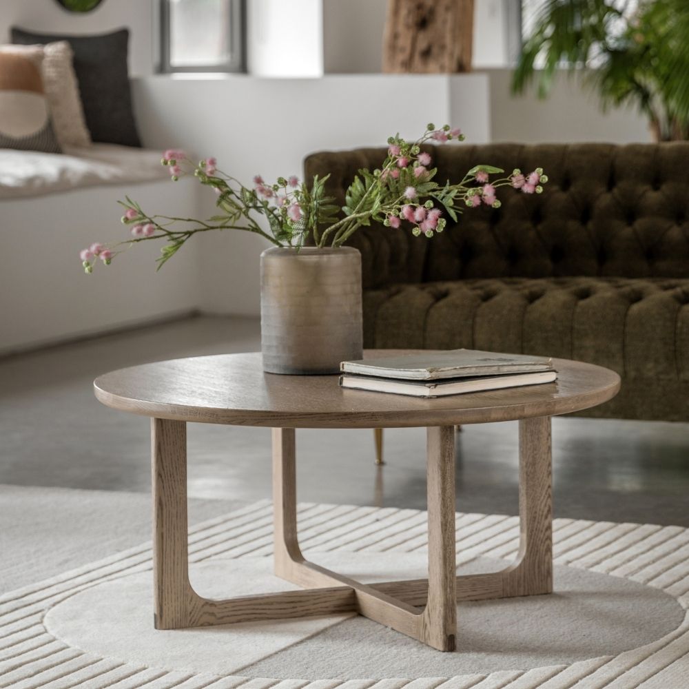 smoked-oak-round-coffee-table-with-curved-frame-in-living-room