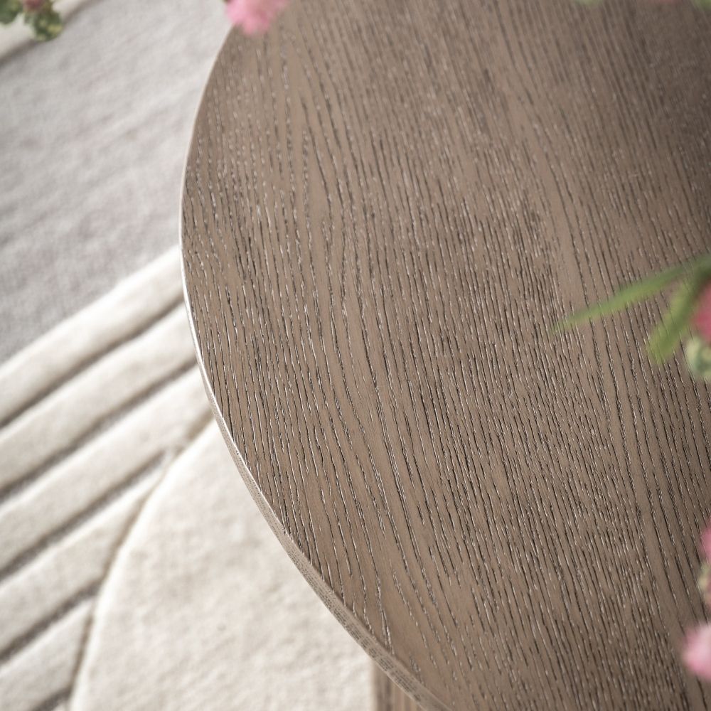 Close up of smoked oak tabletop showing detailed wood grain texture and smooth rounded edge.