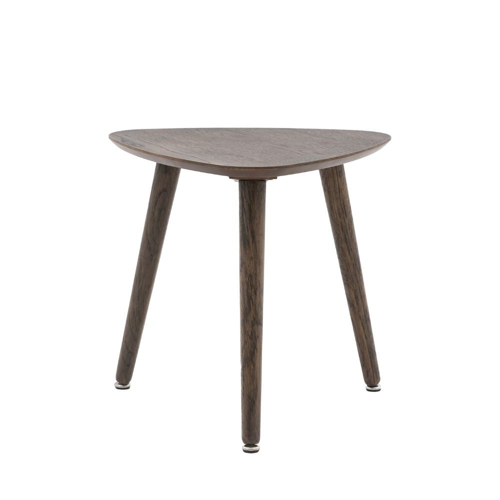 Smoked oak side table with triangular top and three tapered legs showcasing clean mid century modern design on a neutral background.
