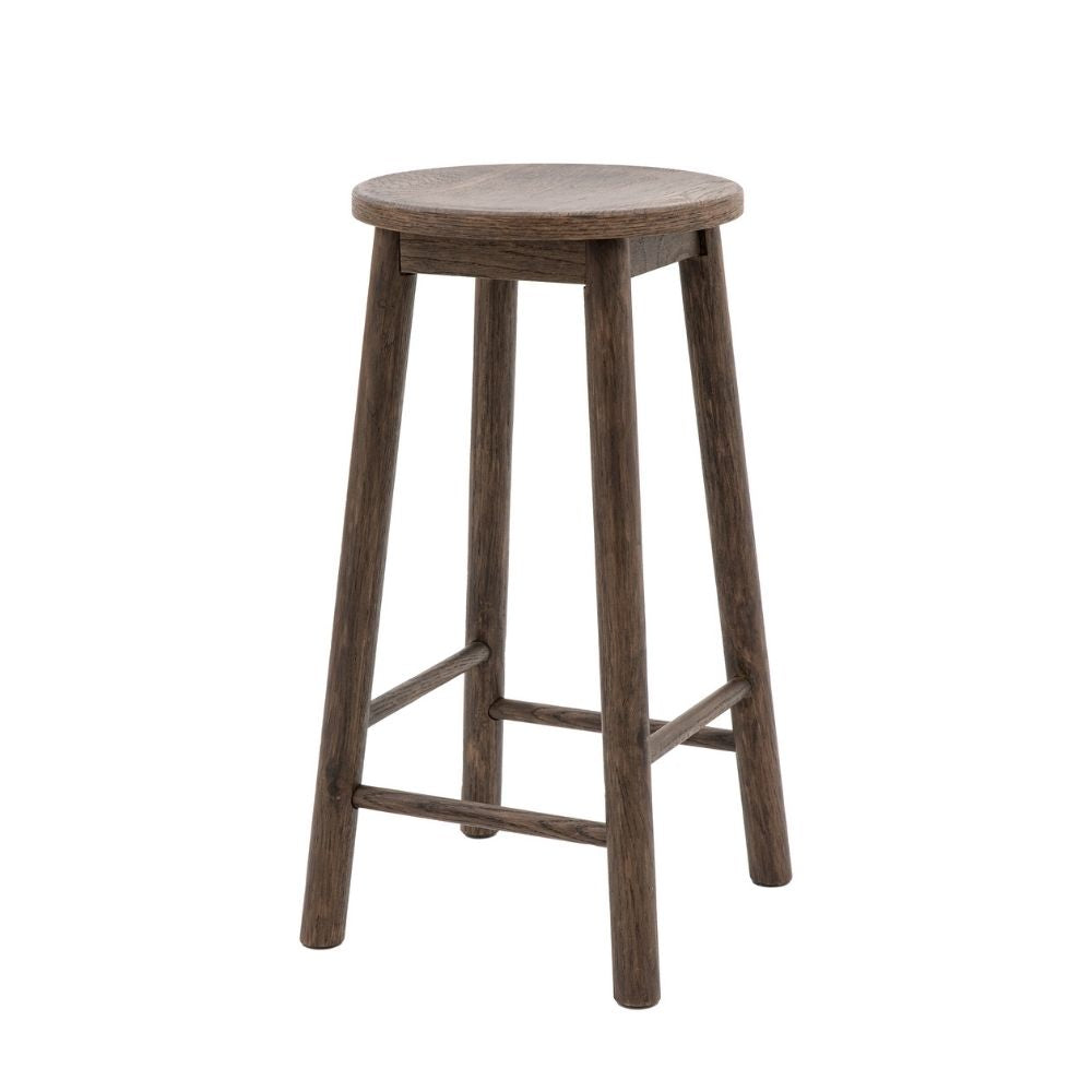 Smoked oak wooden bar stool with round seat and four legs shown against a plain light background.