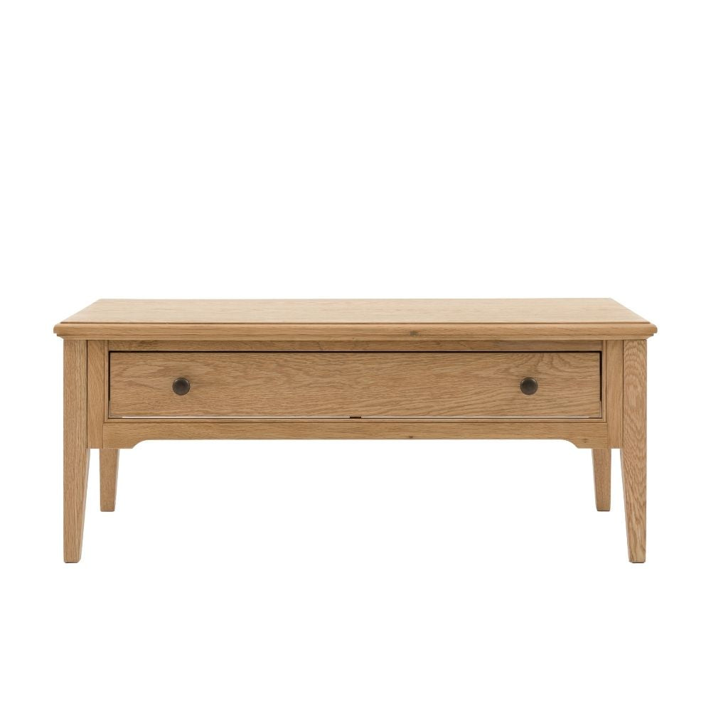 Solid oak rectangular coffee table featuring a single drawer with classic round handles on a clean neutral background.