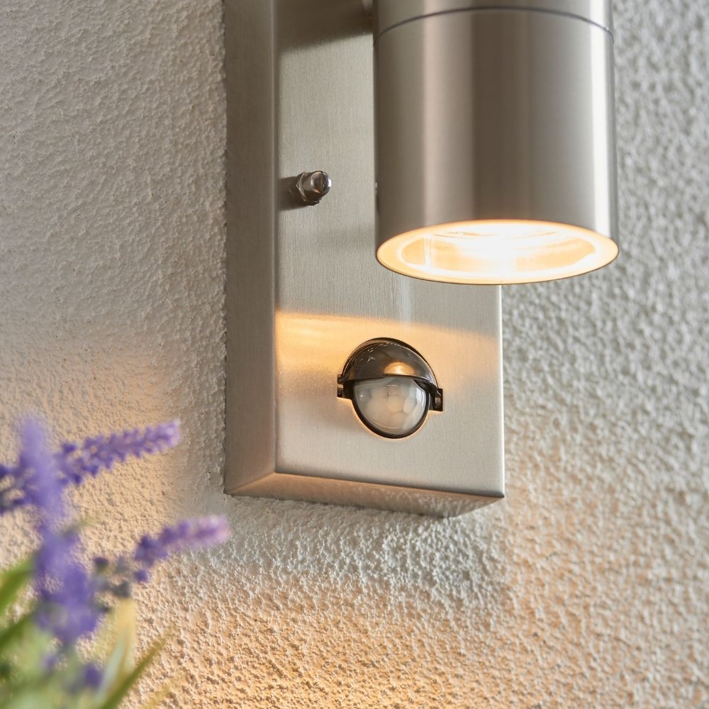 Outdoor stainless steel wall light requiring two GU10 bulbs with up and down lighting and motion sensor feature.