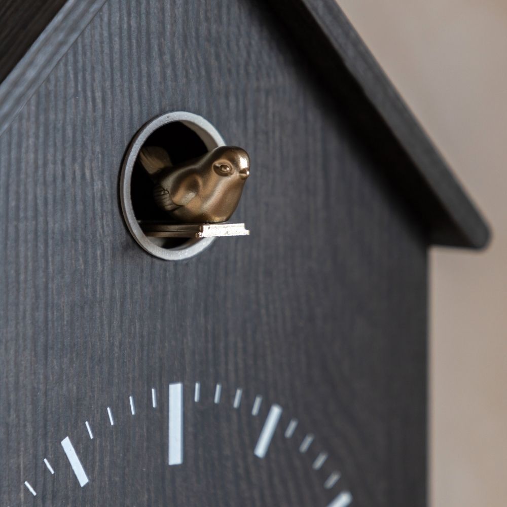 Close-up of the cuckoo bird on the Thomas Kent charcoal cuckoo wall clock with dark wood-effect case