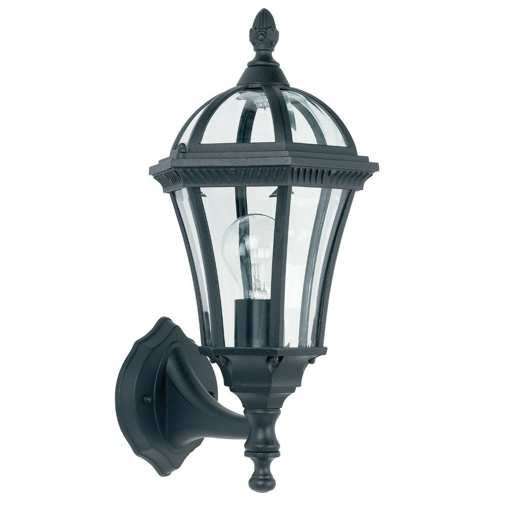 Traditional black wall lantern with curved glass panels and decorative top finial isolated on plain background.