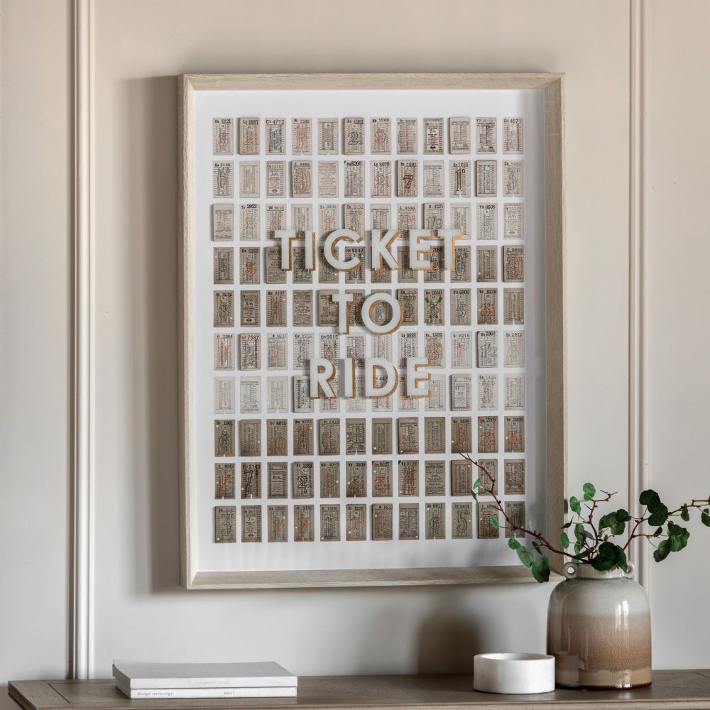 Vintage-inspired ticket collage wall art featuring “Ticket To Ride” typography with retro London transport tickets in a light wood frame.