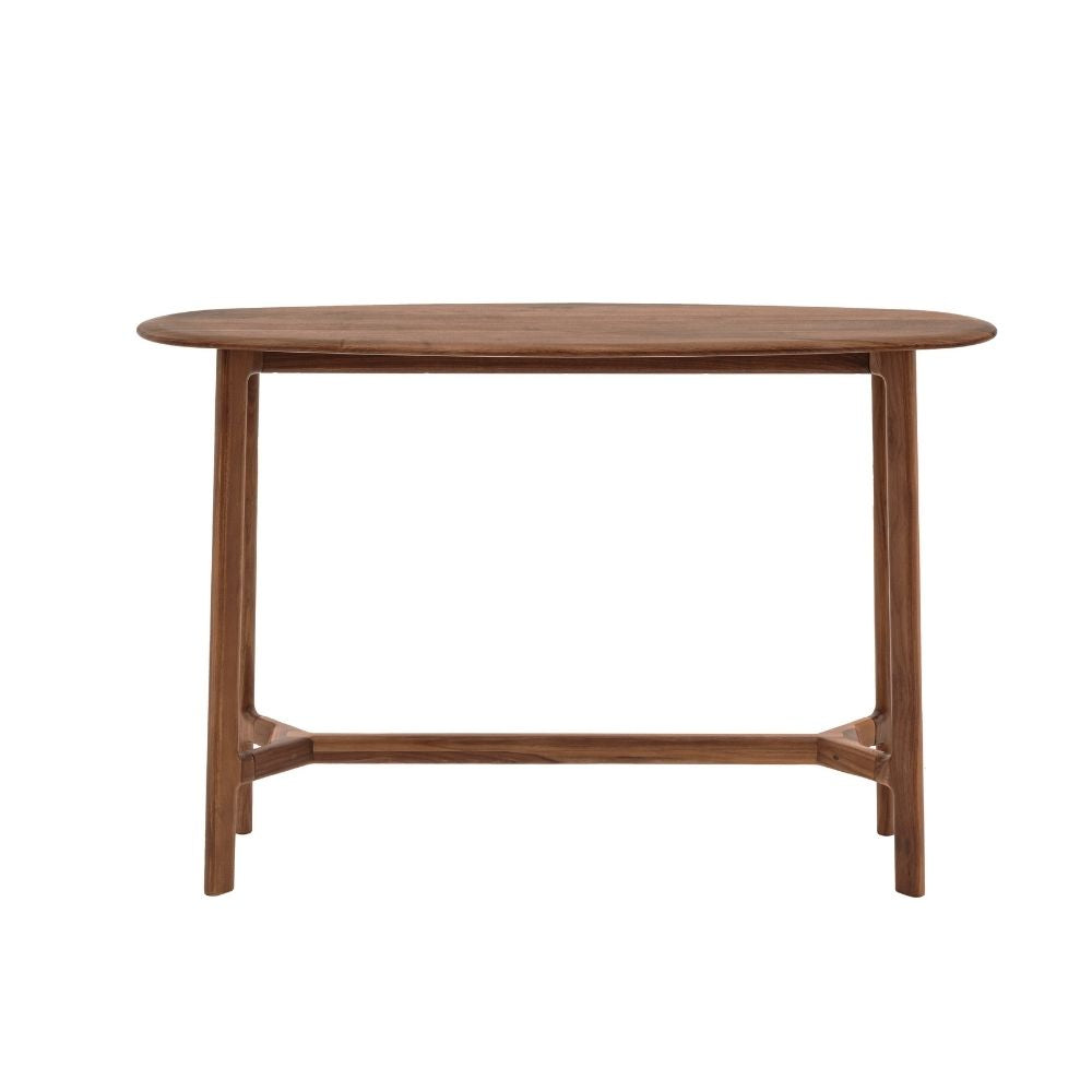 Minimalist walnut console table featuring a smooth curved boat shaped top and tapered legs on a plain background.