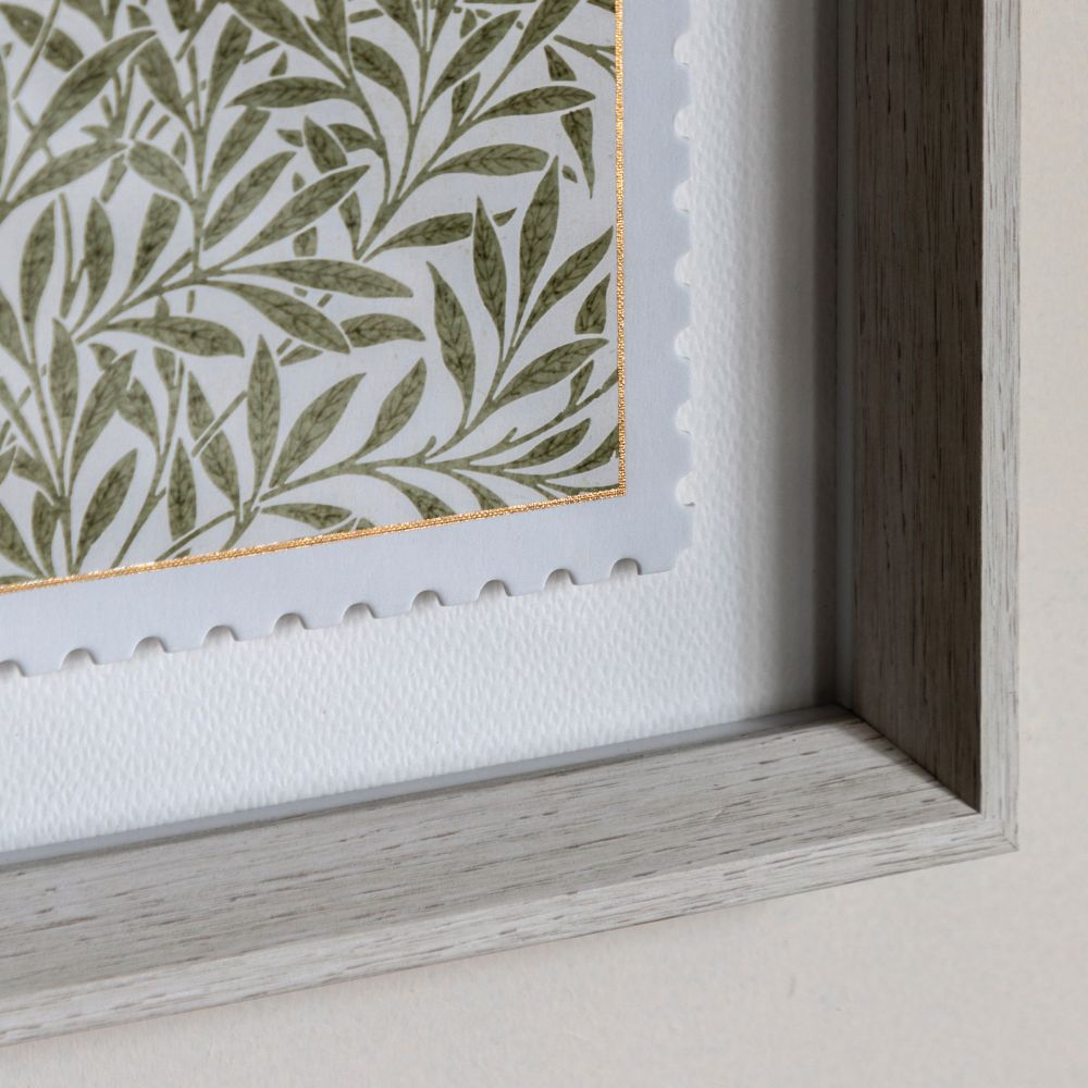 Detailed close-up of William Morris Willow Bough framed print featuring botanical leaf pattern and decorative stamp-inspired edging.