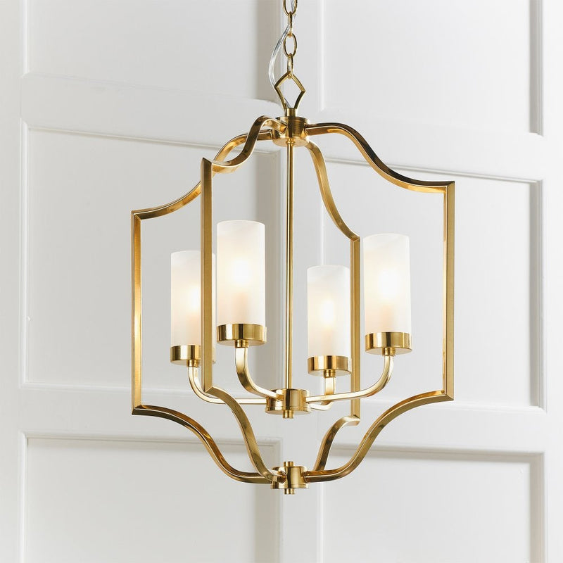 A beautifully crafted brass chandelier with frosted glass shades, offering a timeless elegance and warm ambient lighting for any space.
