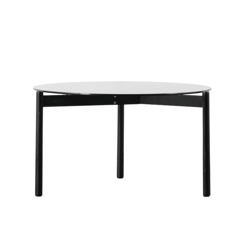 This elegant round black oak coffee table with a glass top adds a sophisticated touch to any home, combining durability with minimalist design.
